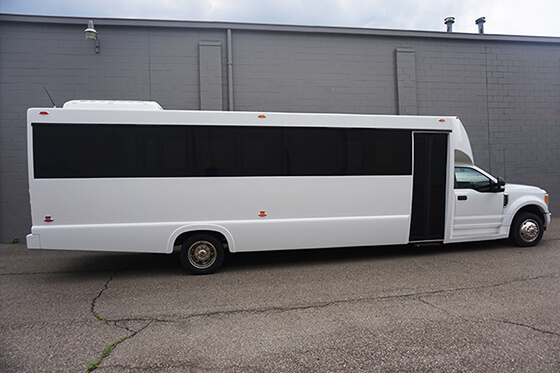 white bus with tinted windows